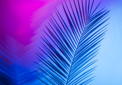 Full frame shot of blue sky over colored background