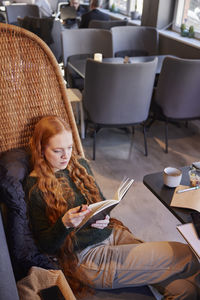 Young woman studying in cafe