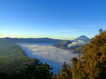 Scenic view of mountains against clear blue sky