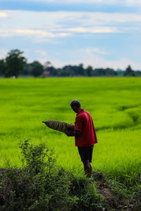 Full length of man standing in field