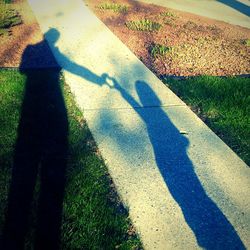 Shadow of people on grass