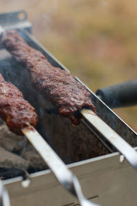 Close-up of meat on barbecue grill