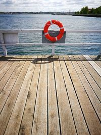 View of jetty on sea against sky