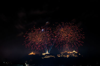 Firework display at night