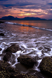 Scenic view of sea against sky during sunset