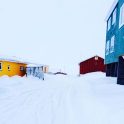 Houses on snow covered landscape