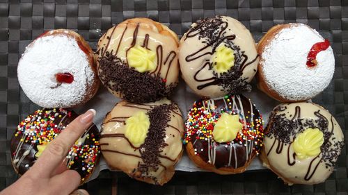 High angle view of multi colored doughnuts 