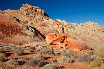 Scenic view of rocky mountains against clear sky