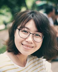 Portrait of smiling woman wearing eyeglasses