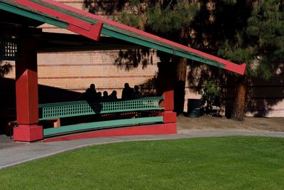 People on bench in park