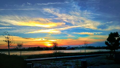 Scenic view of silhouette landscape against sky at sunset