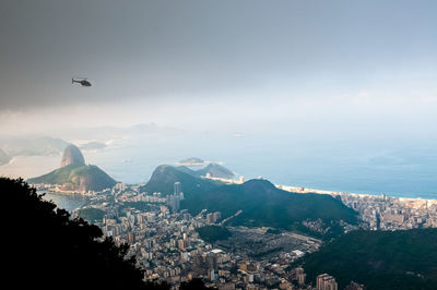 Rio de janeiro from the top of the mountain. flying helicopter and sugarloaf mountain