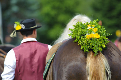 People with traditional bavarian clothing on catholic pilgrimage in kötzting