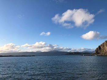 Scenic view of sea against blue sky