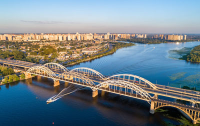 High angle view of bridge over river and buildings in city