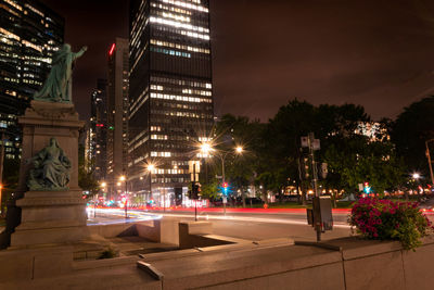 Illuminated buildings in city at night