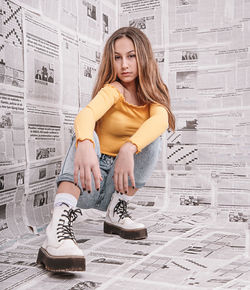 Portrait of a young woman sitting outdoors