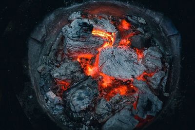 High angle view of fire on wood