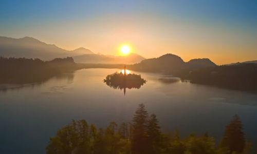 Scenic view of lake against sky during sunset