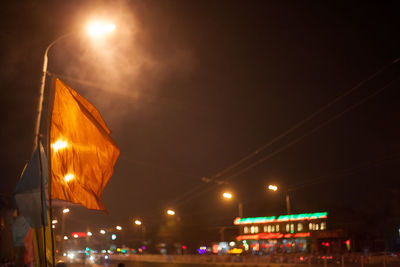 Low angle view of illuminated street light at night