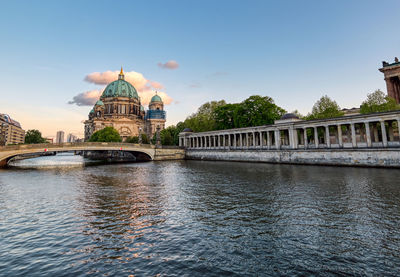 Bridge over river with church in background