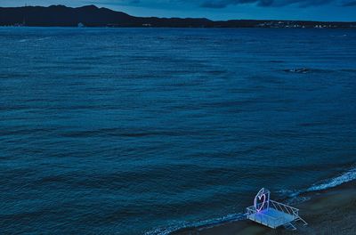 High angle view of sea against mountain