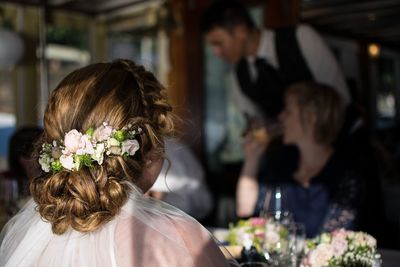 Close-up of people sitting in restaurant