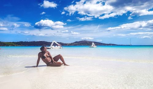 Man on beach against sky