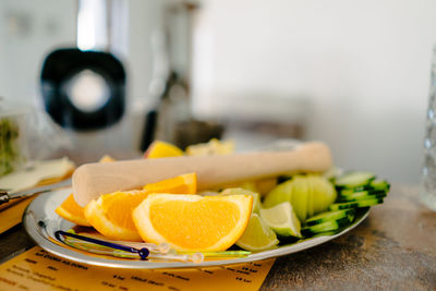 Close-up of fruits in plate on table