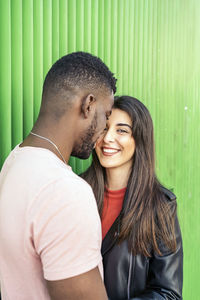 Portrait of young couple standing outdoors