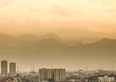 Buildings in city against sky