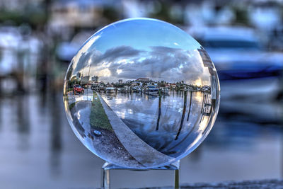 Close-up of crystal ball in city