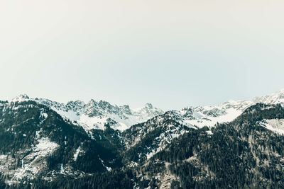 Scenic view of snowcapped mountains against clear sky