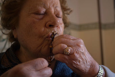 Close-up of man smoking cigarette