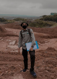 Full length of man standing on land