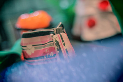 Close-up of purse on table