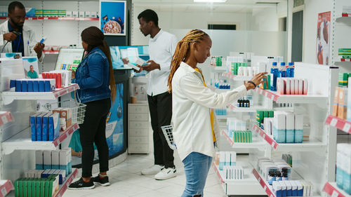 Rear view of doctor examining chemical