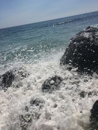 Waves splashing on rocks