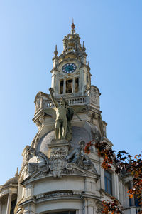 Low angle view of statue against building