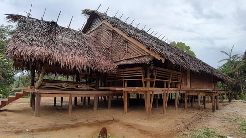 Built structure on beach against sky