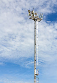 Low angle view of communications tower against sky