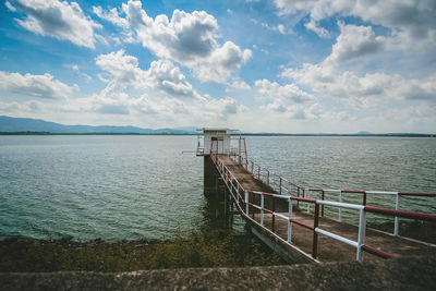 Pier over sea against sky