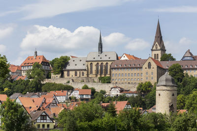 Houses in town against sky