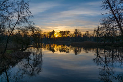 Scenic view of lake against sky during sunset