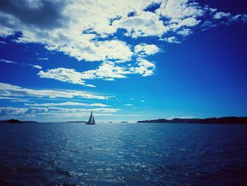 Scenic view of sea against cloudy sky