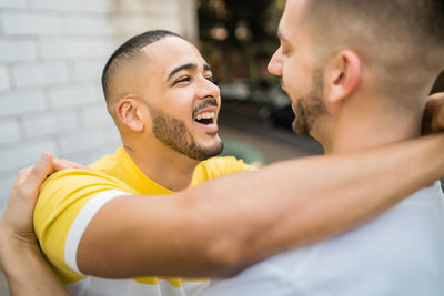 Gay couple embracing outdoors