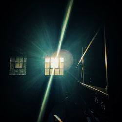 Low angle view of illuminated lights at night
