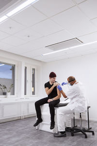 Young man getting vaccinated against covid-19