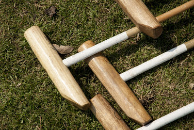 Close-up of polo sticks on grass