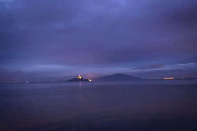 Scenic view of sea against sky at night